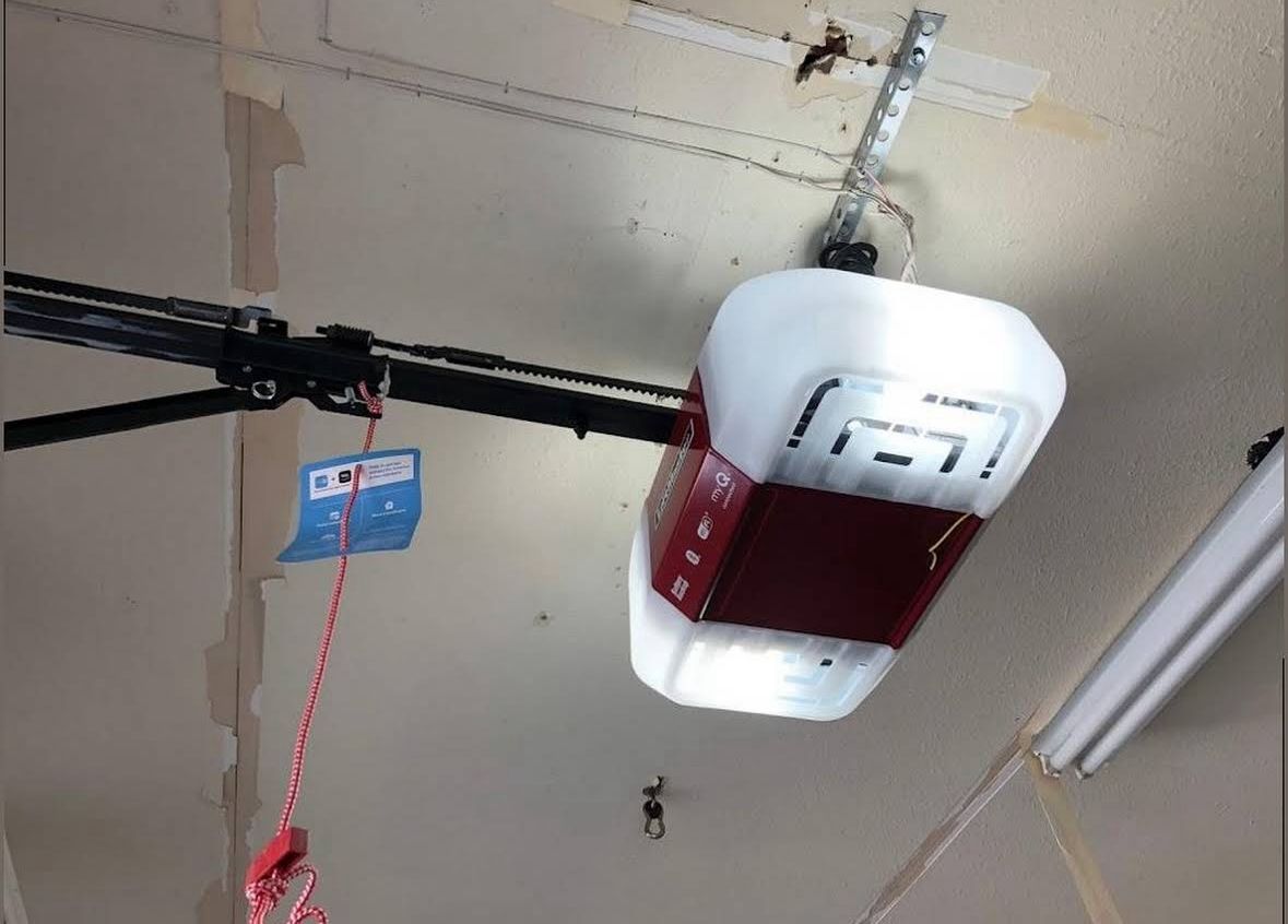 Belt-drive garage door opener installed and wired to the ceiling mount