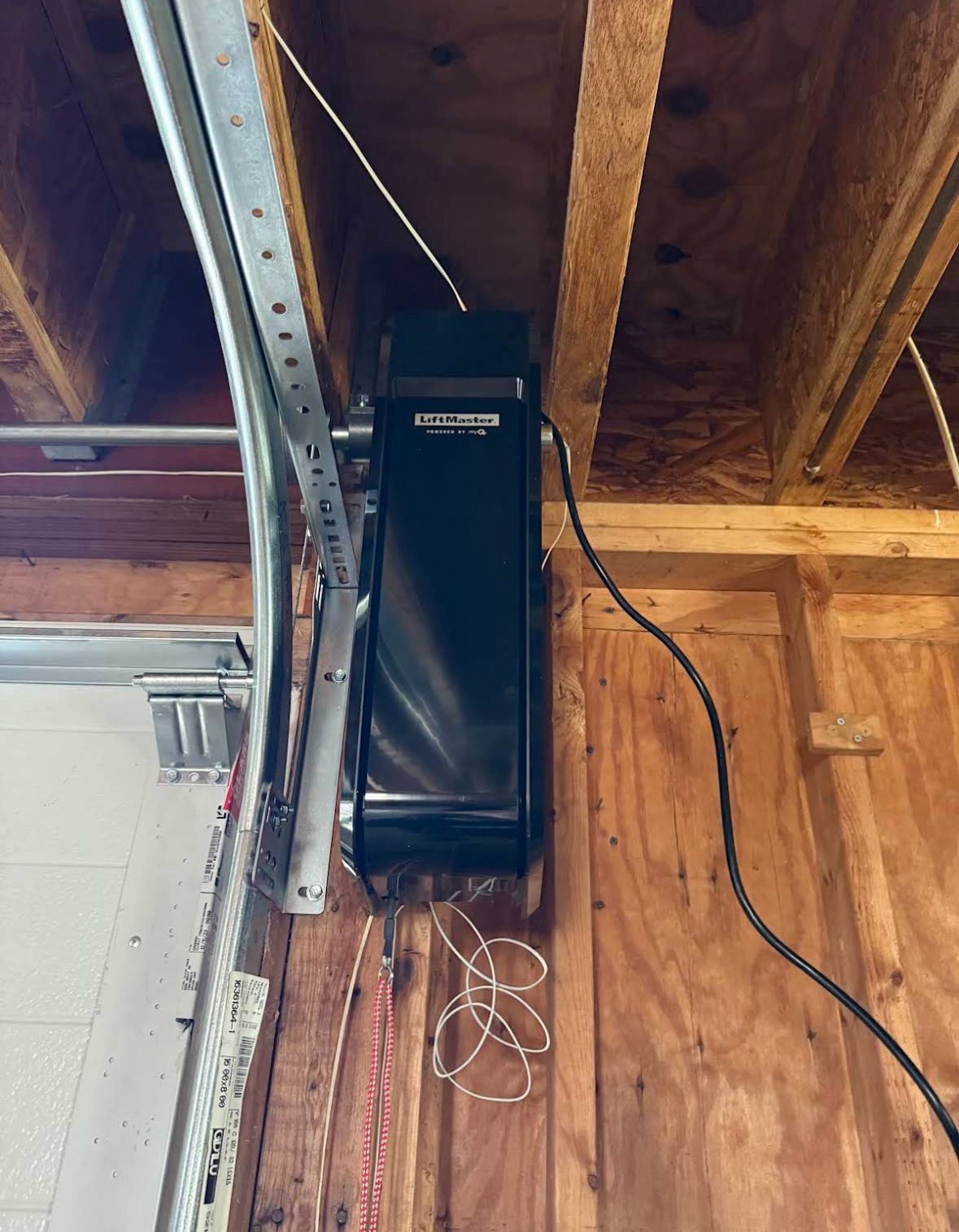 LiftMaster opener mounted to the framing above a new sectional door